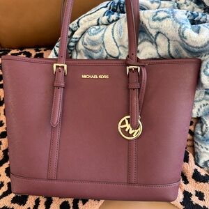 Michael Kors purses just too big for me. Very pretty oxblood color